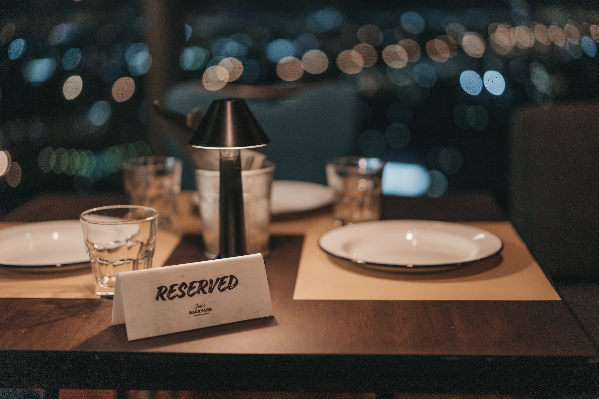A picture describing a fine dining restaurant table that is reserved for a guest