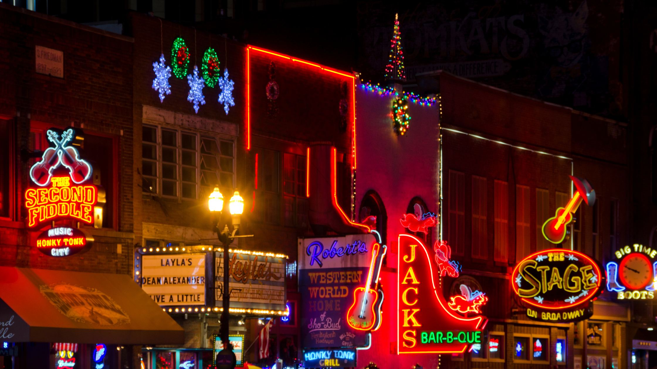 Image of neon signs on the street during nighttime