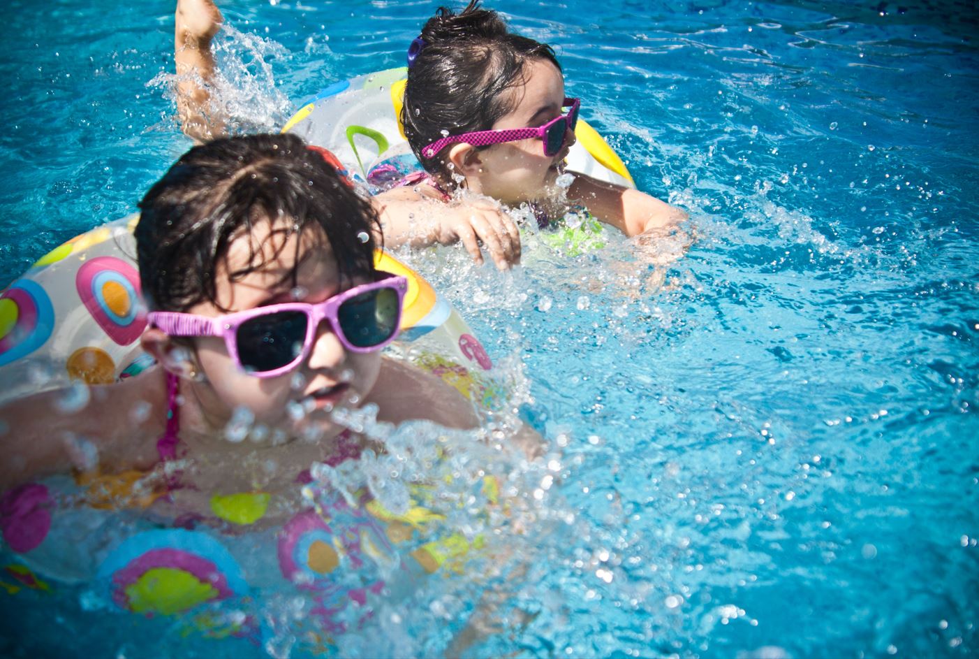 two children in a pool, enjoying a Destin water park weekend