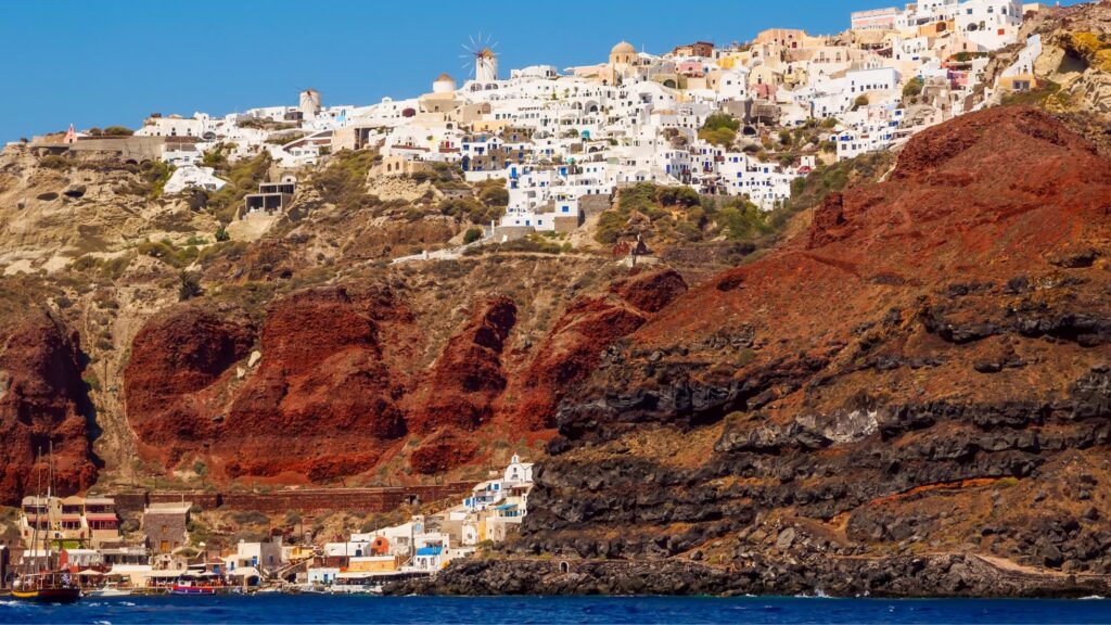A view of the caves in Santorini from the sea.