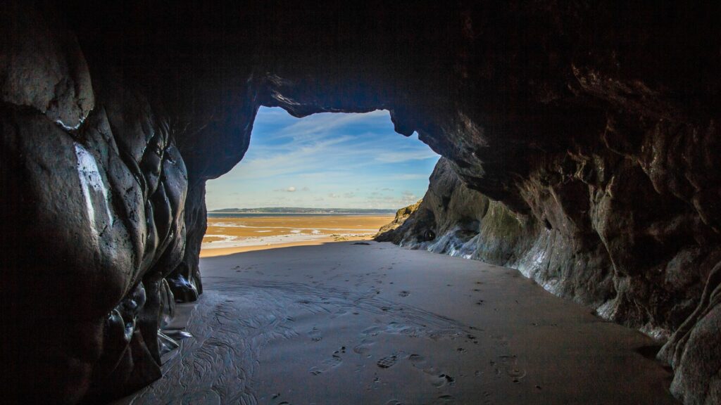A cave in Santorini with the view of the beach