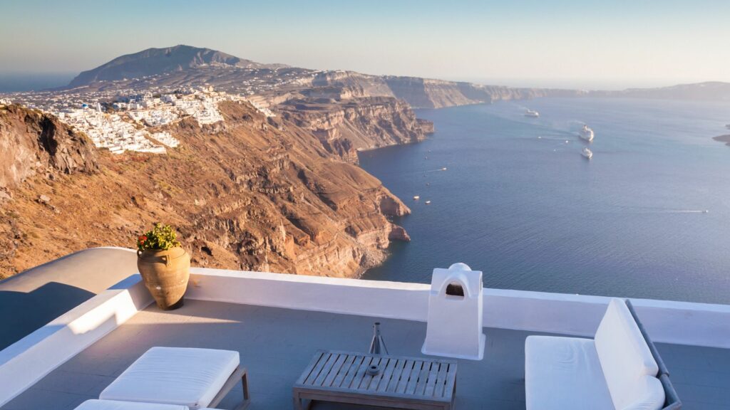 A balcony in Santorini with an overlooking view of the Aegean sea.