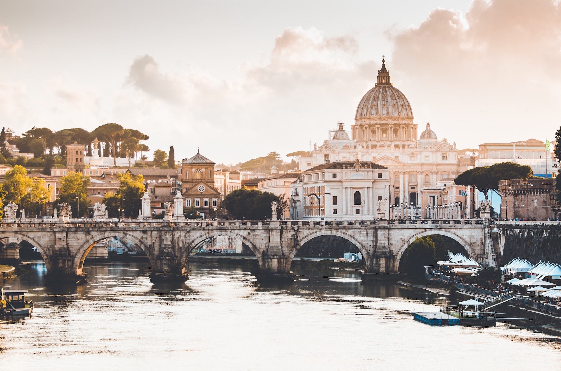 A bridge by the river at Vatican City, a popular destination for day trips in Rome