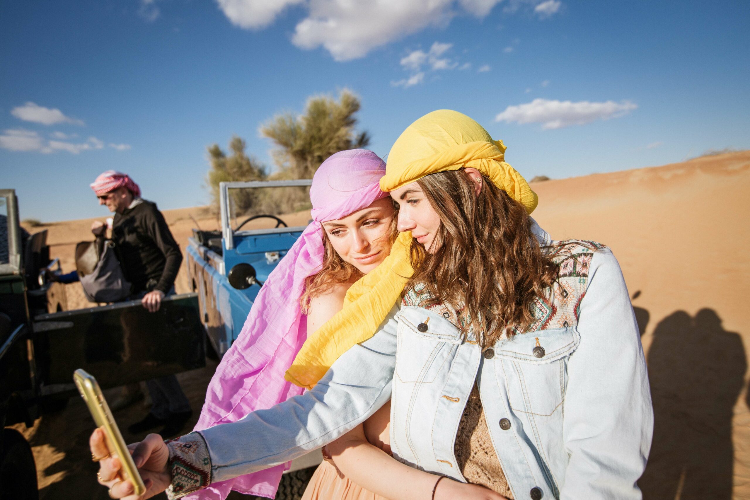 Two Women Wearing Head Scarf Taking Selfie Together during their Dubai adventure